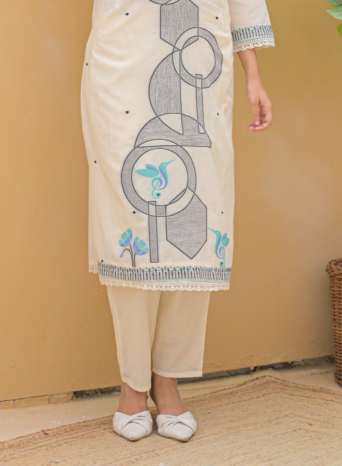 Cream embroidered suit set featuring geometric and floral designs on kurta with matching pants from Dharini's Store