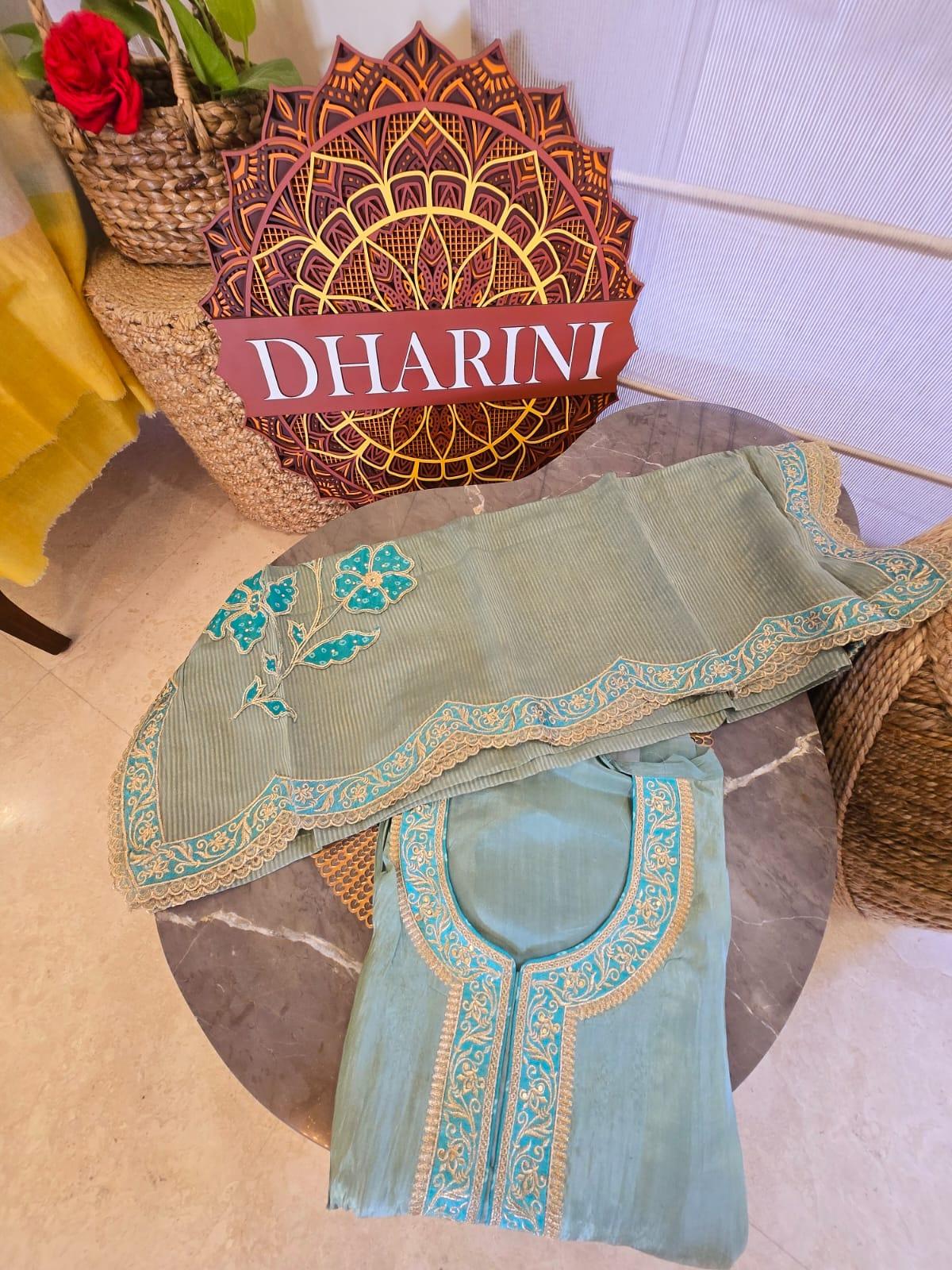 Sea green pure silk suit with floral embroidery and detailed neckline from Dharini's Store