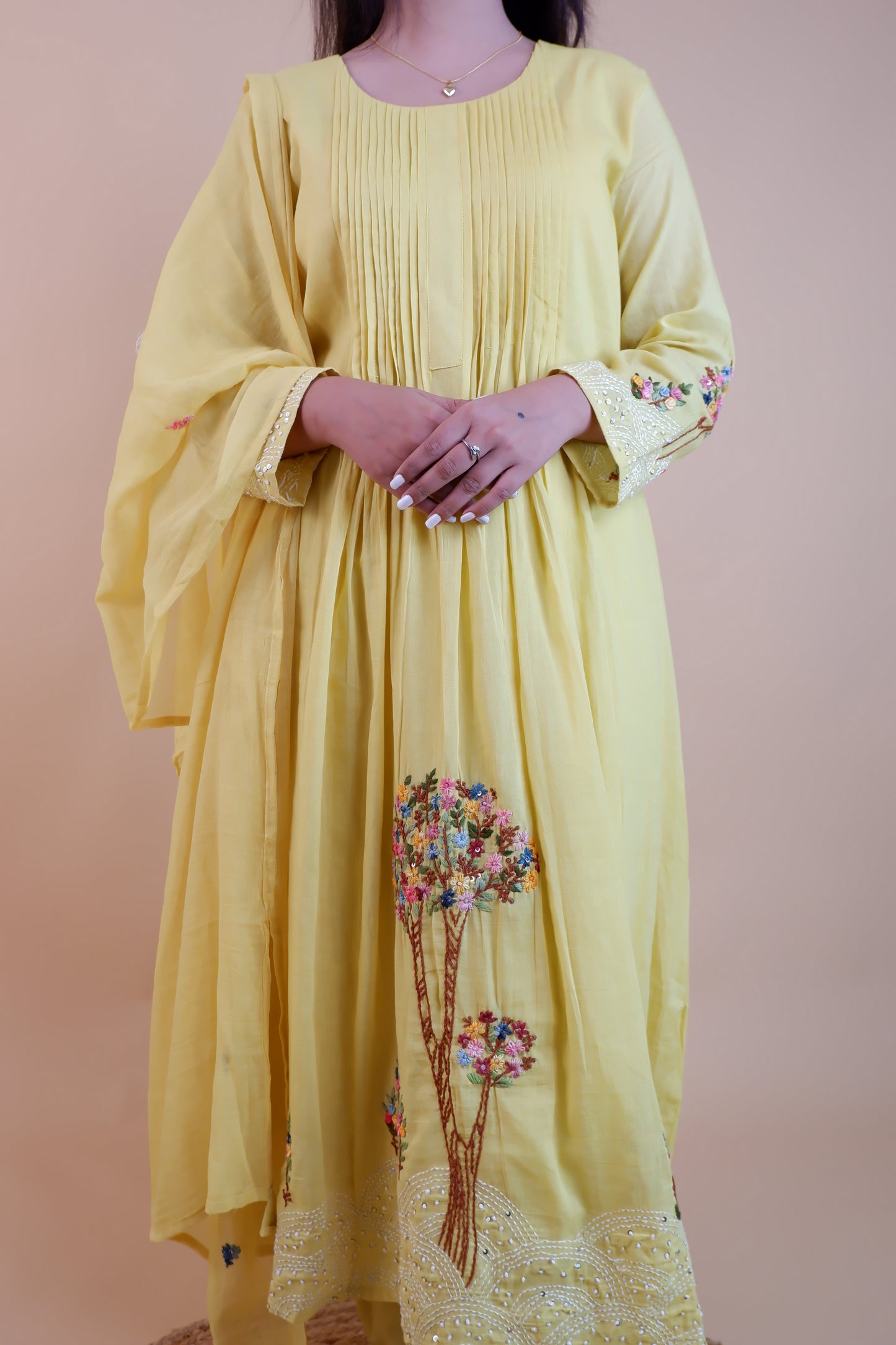 Yellow embroidered cotton dress with floral designs and pleated front from Dharini's Store