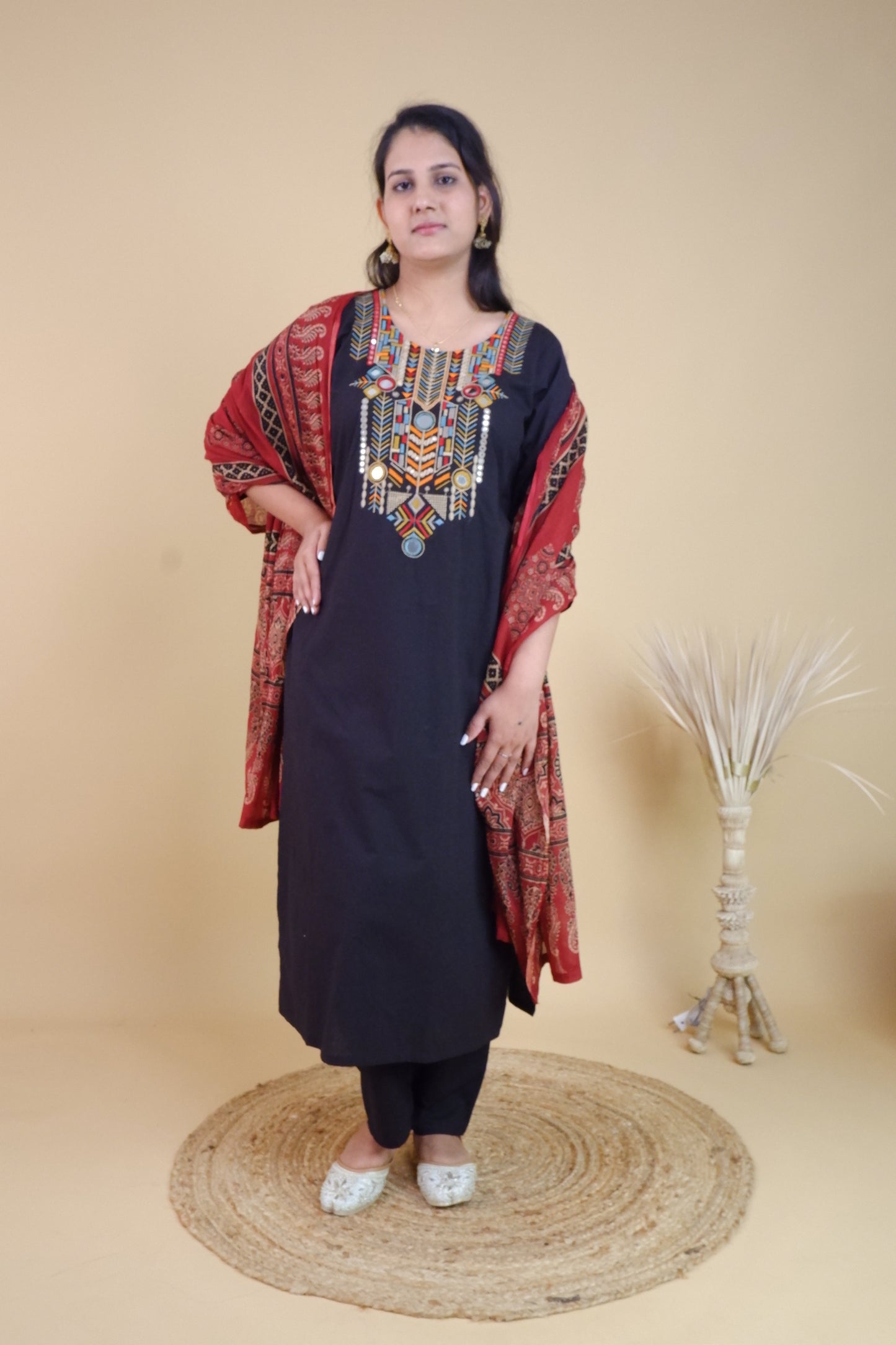 Dharini's Store stitched black cotton festive suit with colorful embroidery and red dupatta