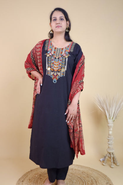 Black cotton festive suit with colorful embroidery and red patterned dupatta from Dharini's Store