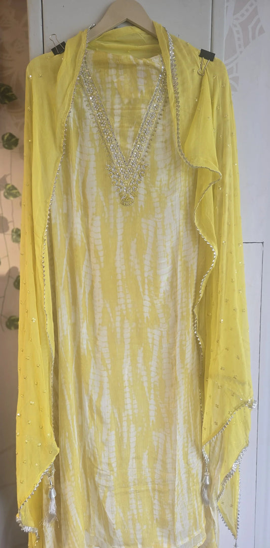 Yellow classic tie-dye suit for women with silver embellishments and matching dupatta from Dharini's Store