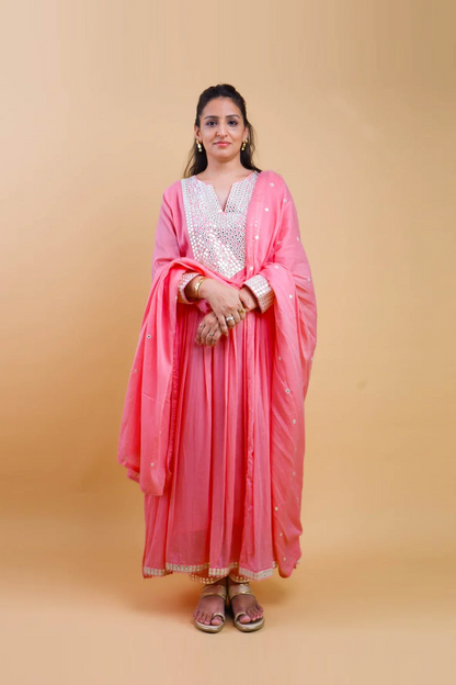 Woman wearing pink cotton anarkali dress for women with silver embroidery and matching dupatta