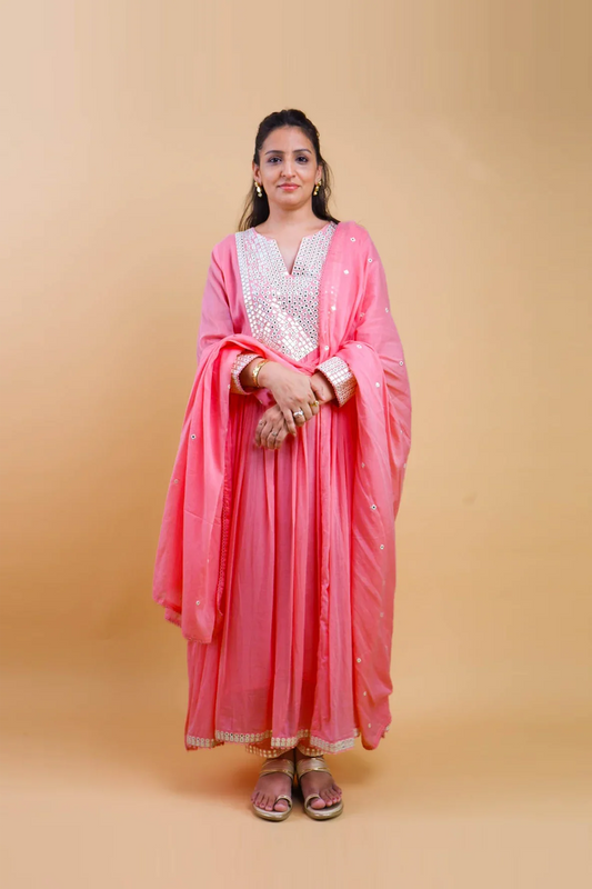 Woman wearing pink cotton anarkali dress for women with silver embroidery and matching dupatta