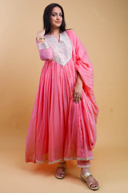 Woman wearing a pink cotton anarkali dress for women with silver embroidery and matching dupatta