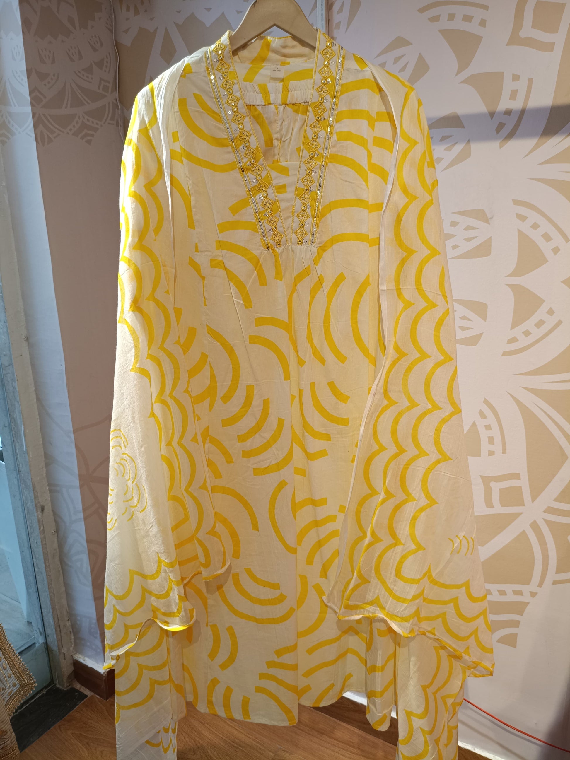 Cream and yellow cotton suit for women with embroidered neckline and abstract pattern