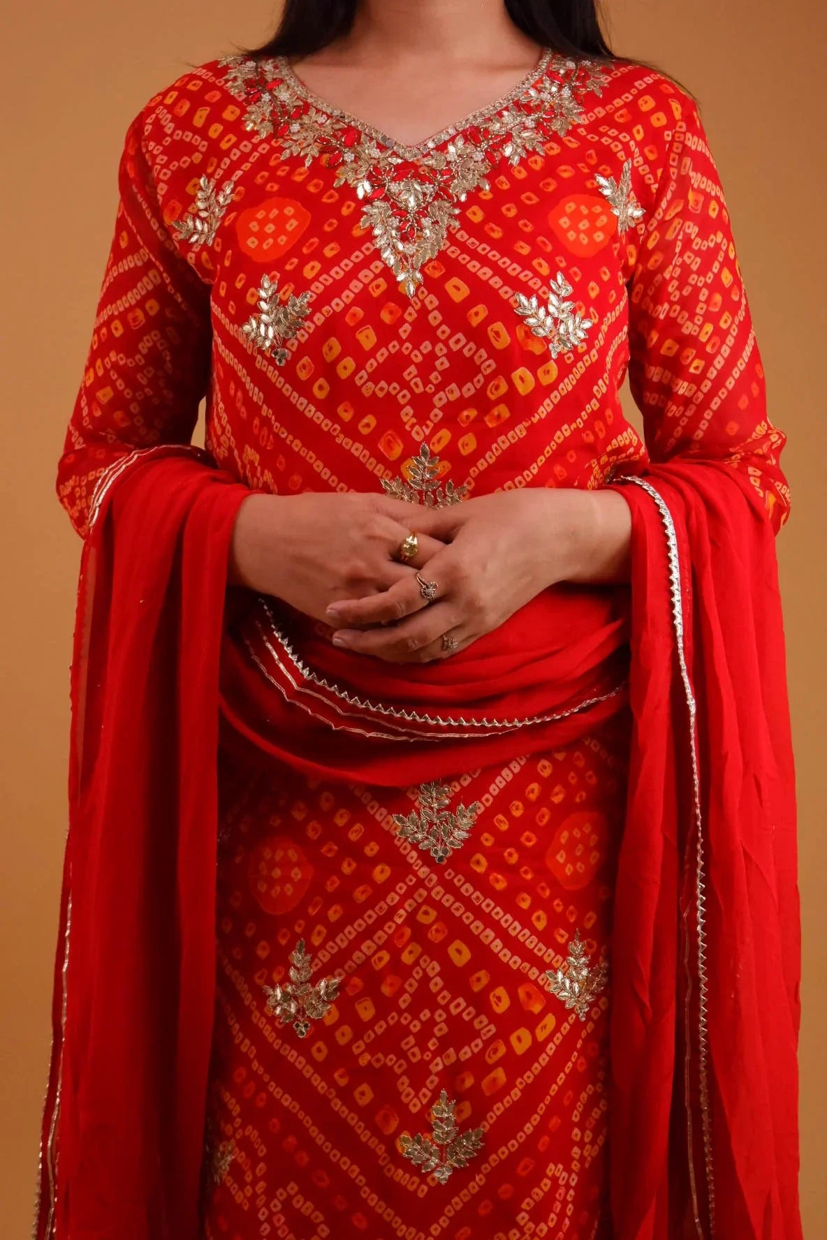 Red Georgette Bandhani suit online with intricate silver embroidery and matching dupatta from Dharini's Store
