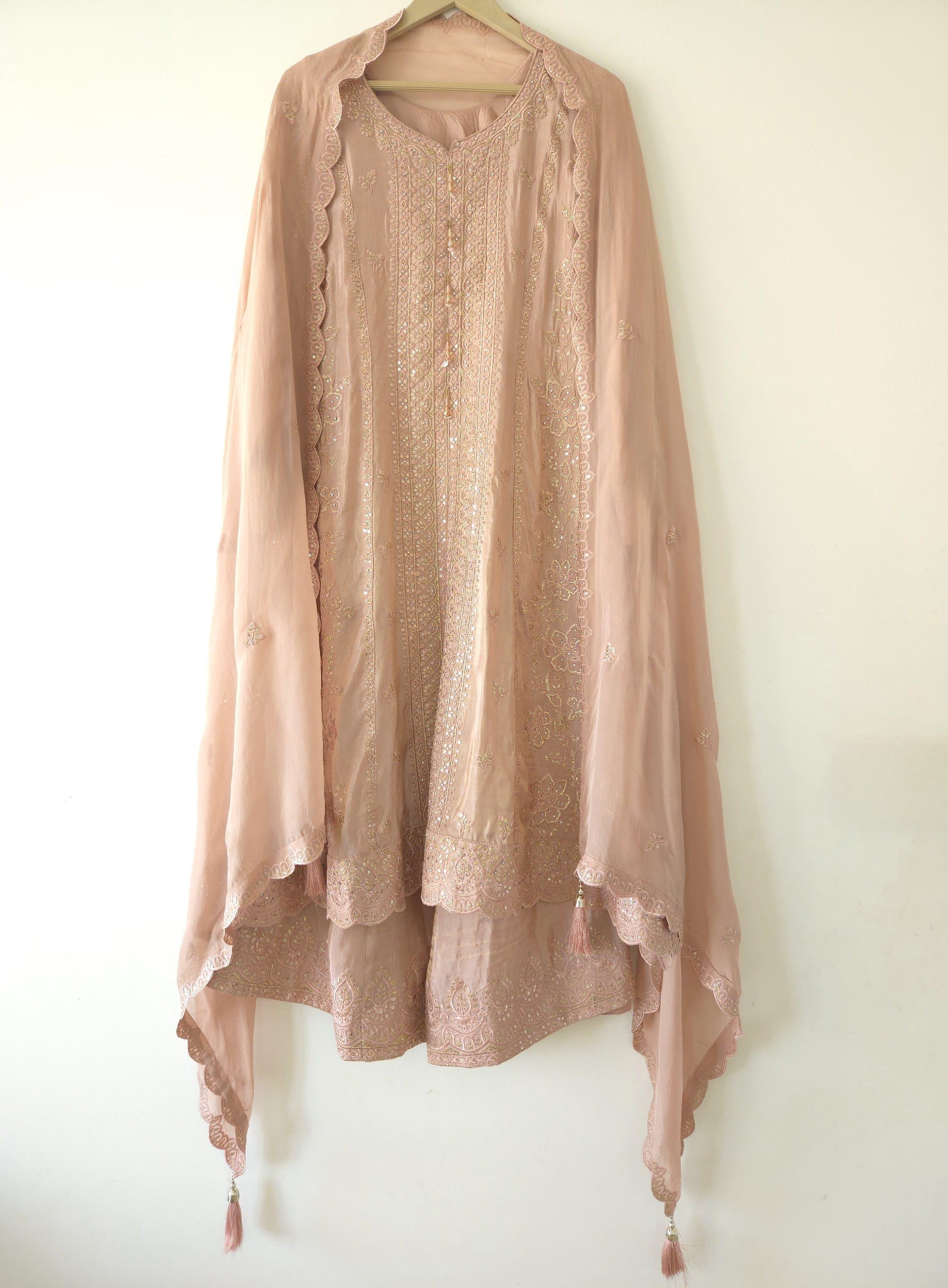 Elegant pink sharara suit set with intricate embroidery and matching dupatta from Dharini's Store