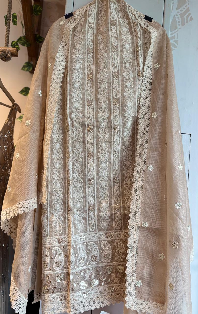 Beige pure cotton kota doria fabric with intricate white embroidery and floral patterns