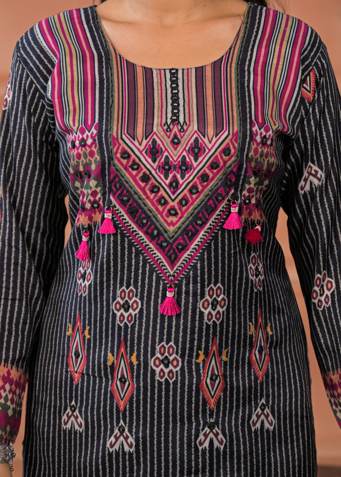 Black striped embroidered suit set with pink and orange detailed embroidery and tassels