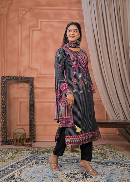 Woman wearing black striped embroidered suit set with pink and red detailed embroidery from Dharini's Store