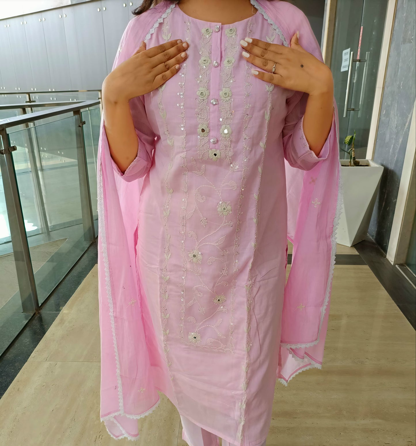 Delicate Indian suit for women in light pink with floral embroidery and matching dupatta