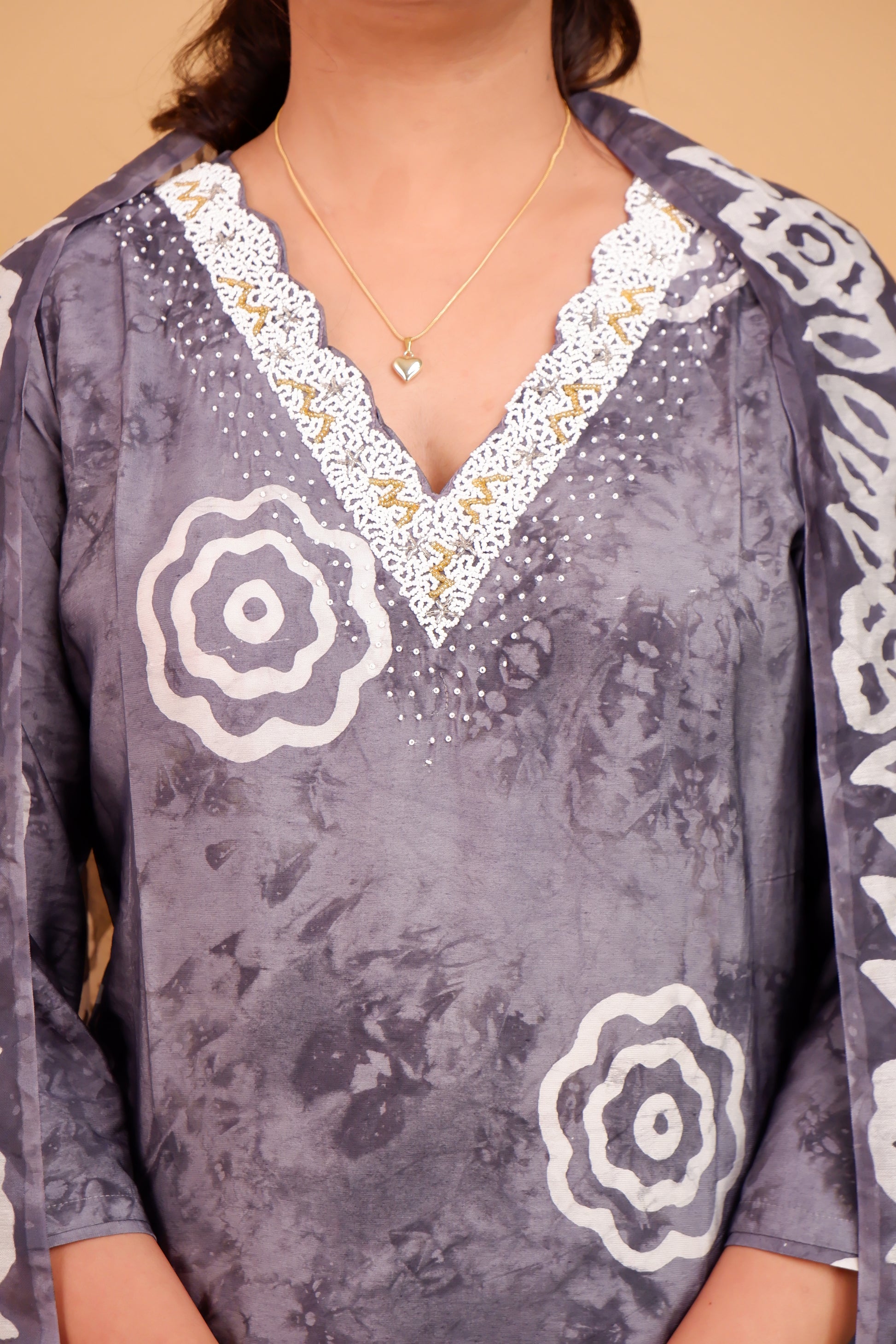 Grey and white cotton suit set with floral patterns and lace neckline from Dharini's Store