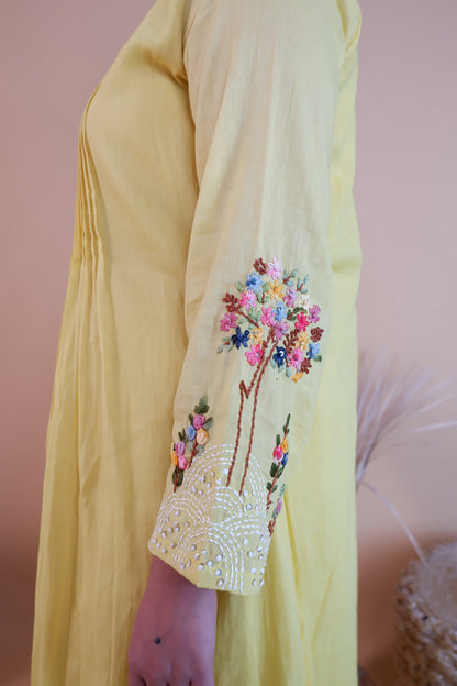 Yellow embroidered cotton dress sleeve with colorful floral embroidery and bead detailing